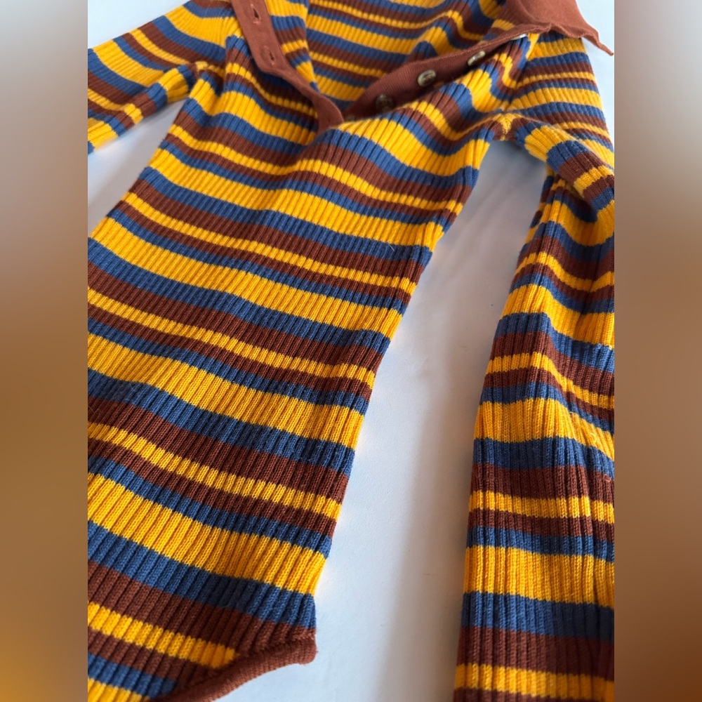Out from under women’s XS polo fitted body suit.